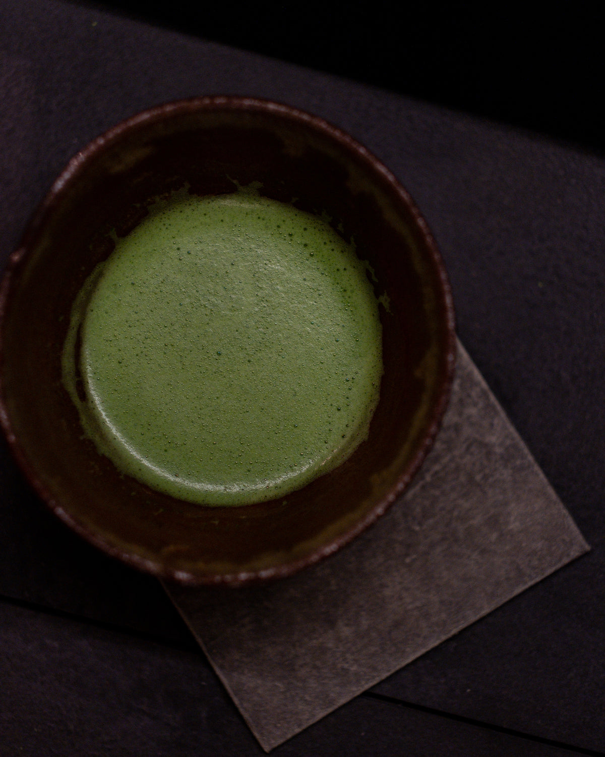 Satori matcha whisked to a smooth, glossy bowl